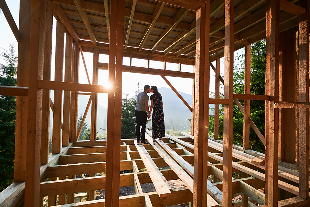 man and woman inspecting their future wooden frame 2023 06 13 18 27 30 utc 2